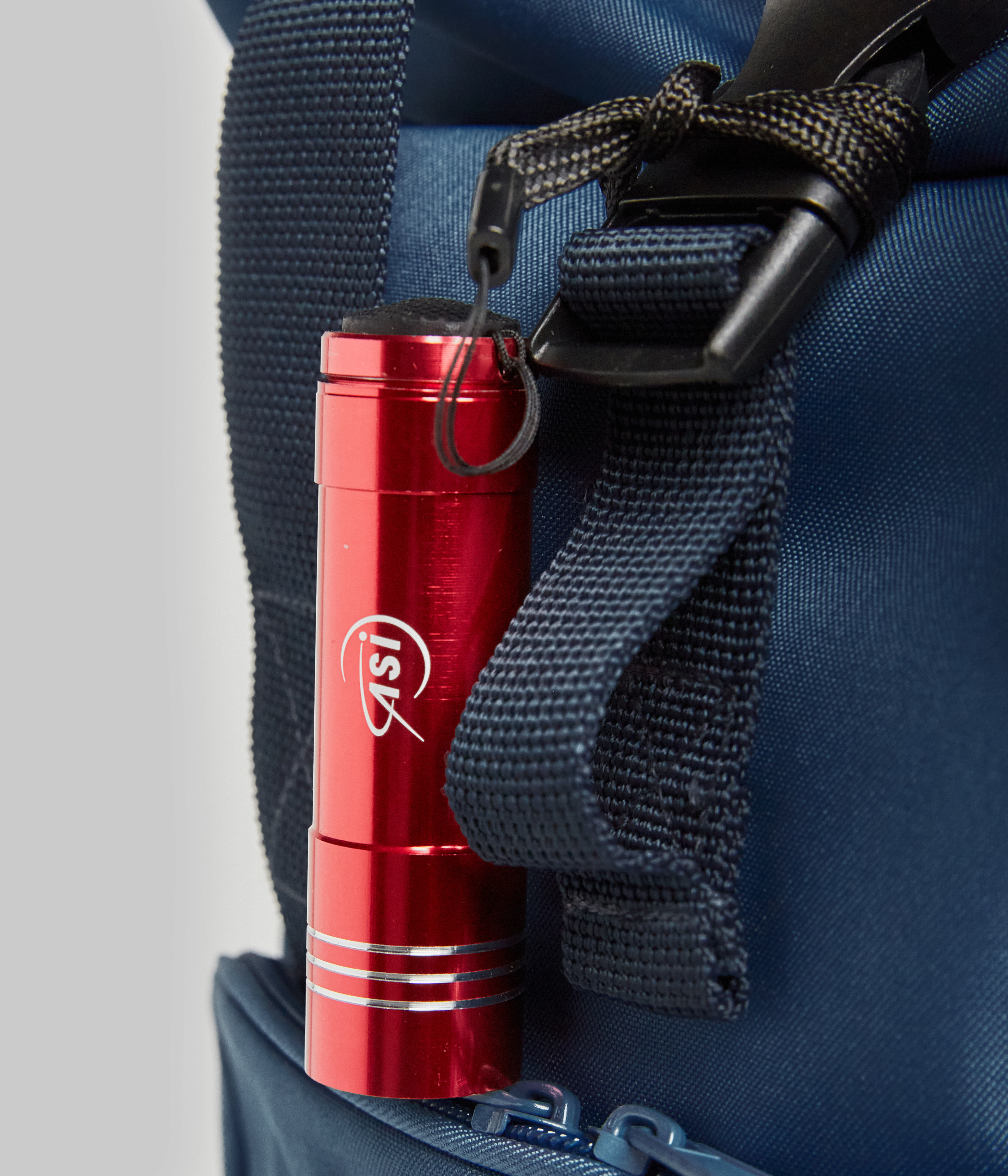 Roll-top backpack with torch and tag set